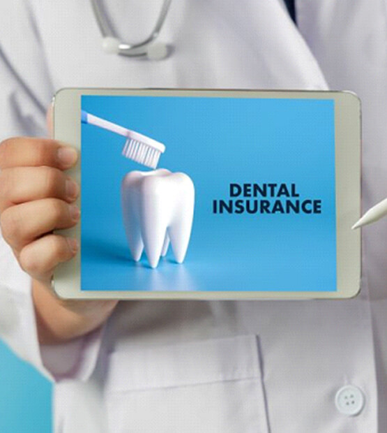 medical professional holding tablet with dental insurance information